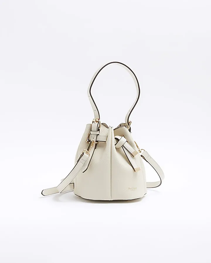 Cream pinched bucket cross body bag