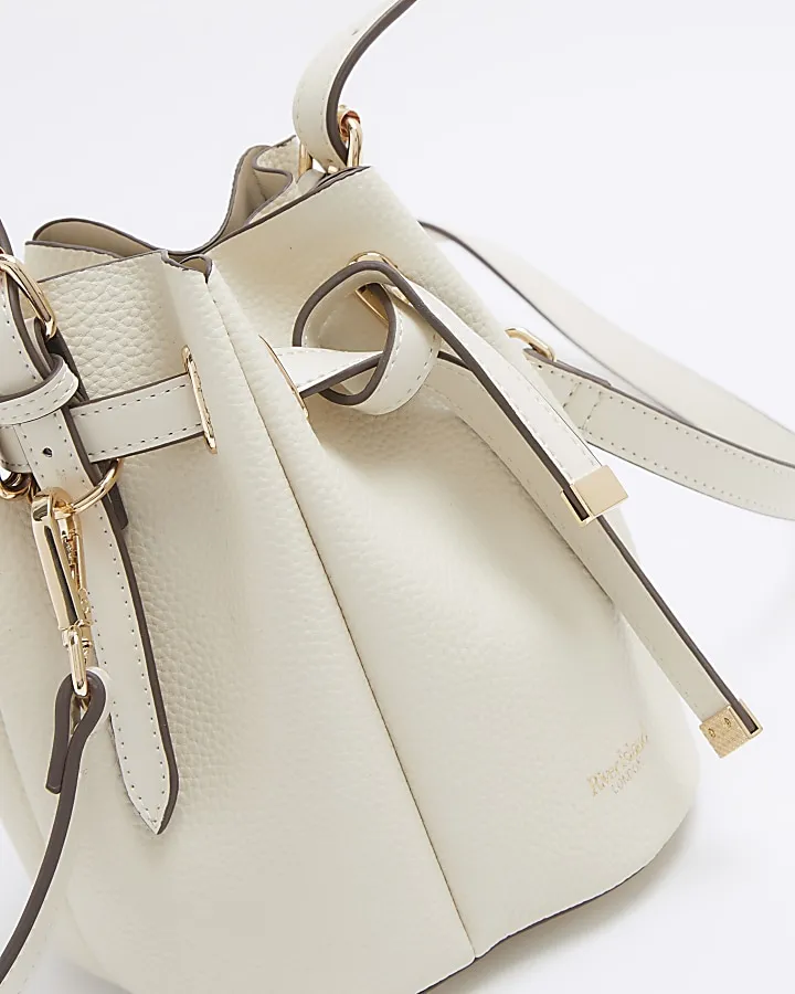 Cream pinched bucket cross body bag