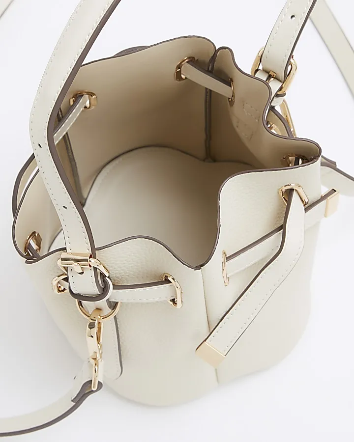 Cream pinched bucket cross body bag